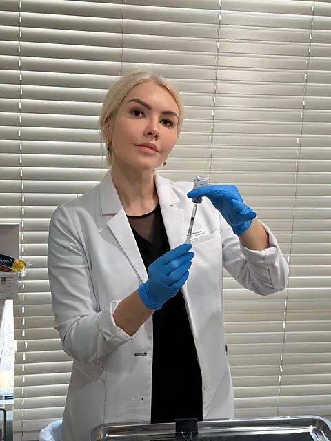 Alina McCann preparing an IV