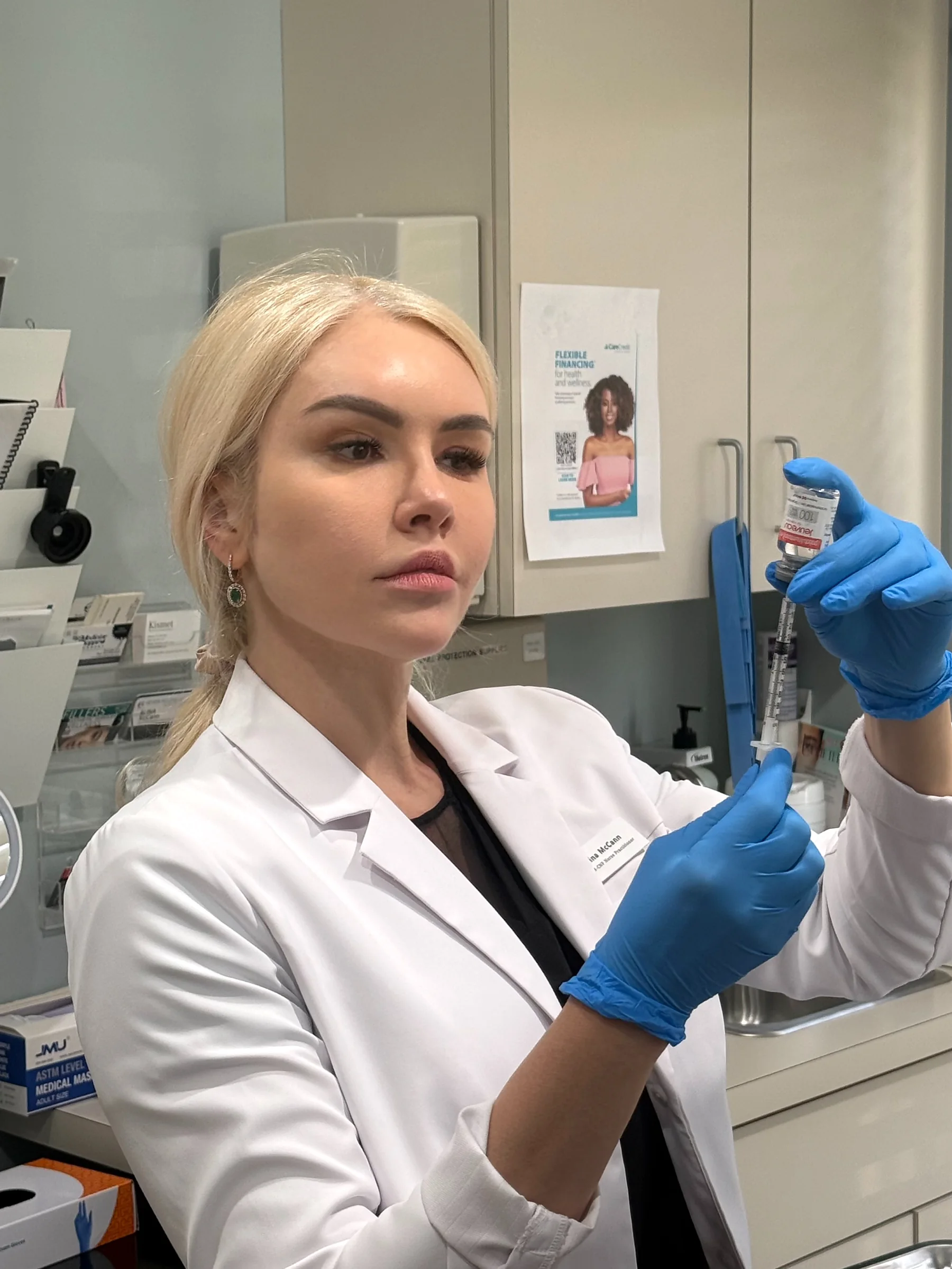 Alina McCann preparing a syringe