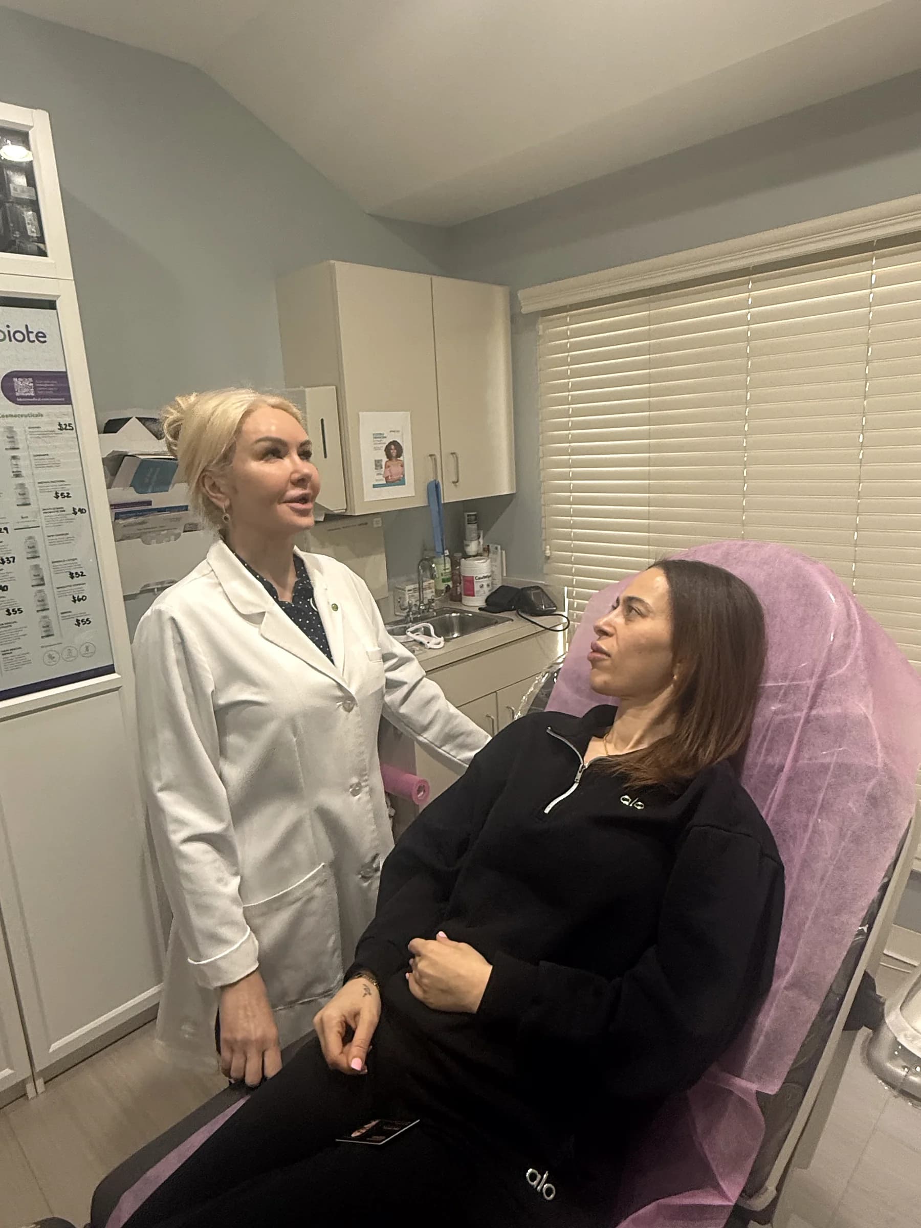 Alina McCann talking a patient through her plan before treatment