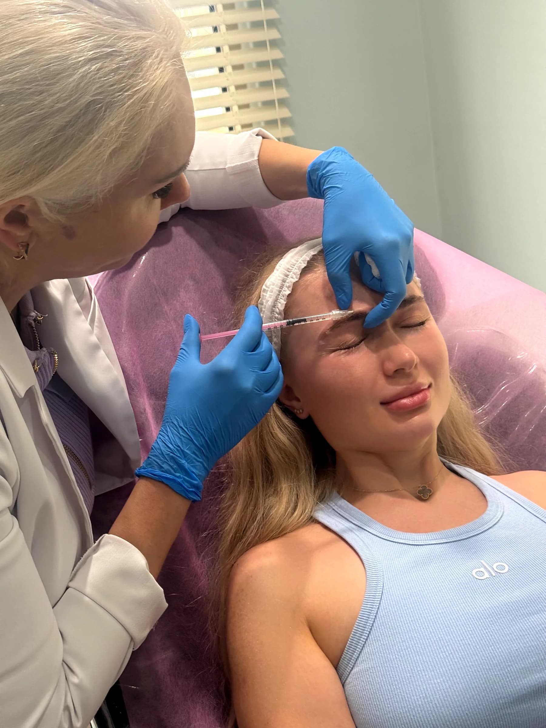 Botox for forehead lines being placed