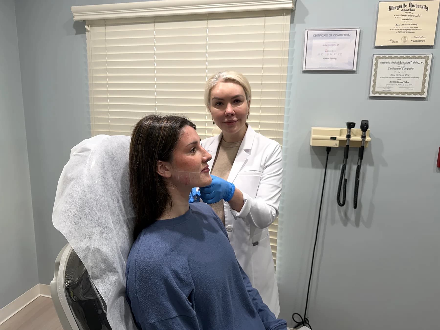 Alina McCann mapping a patient's jawline before filler
