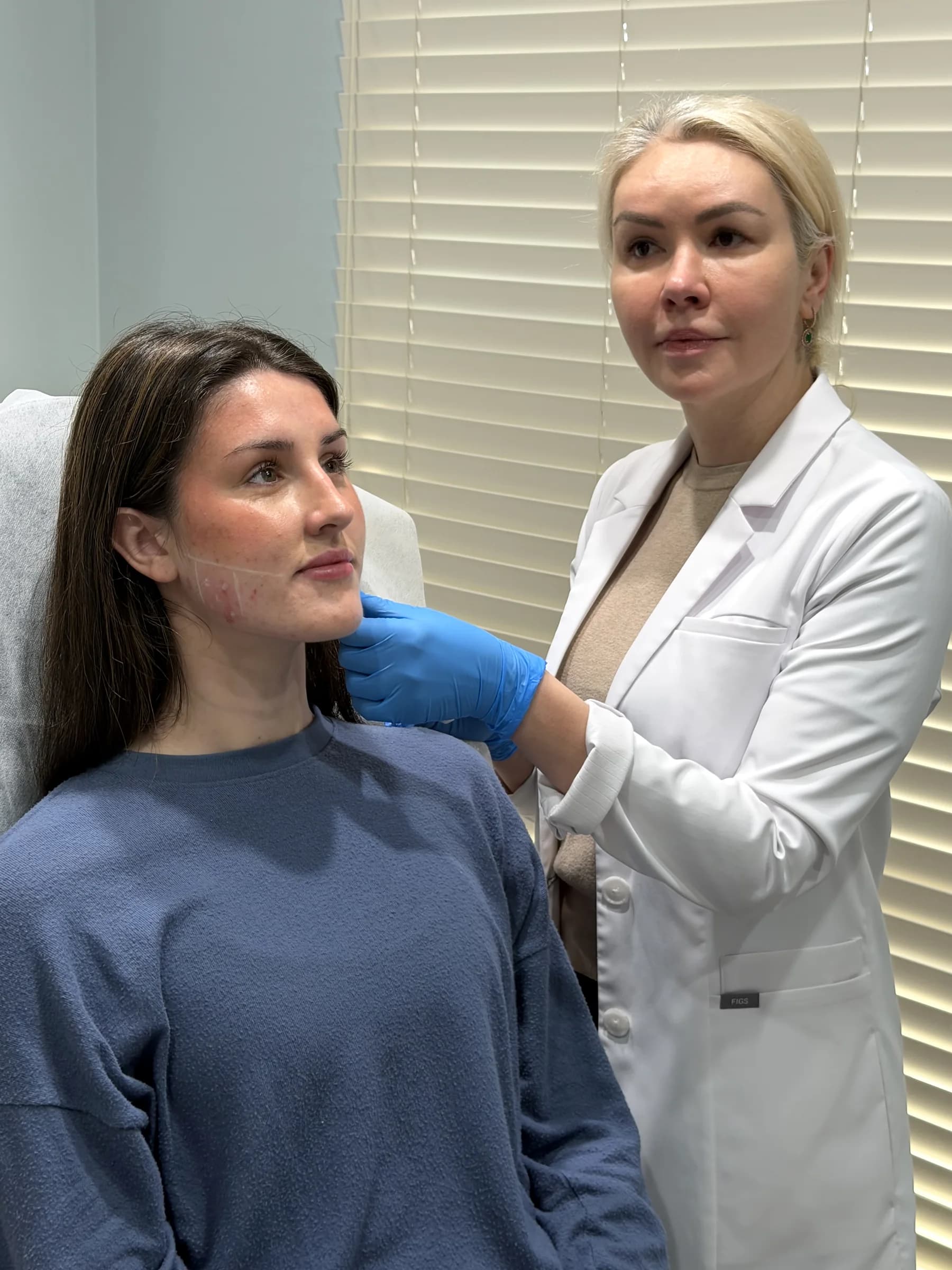 Alina McCann assessing the lower cheek